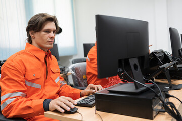 Team male engineers using desktop computer training Programmable logic controller in laboratory....