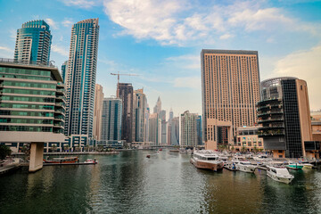 Fototapeta na wymiar Luxury Dubai Marina skyscrapers, cruise boat , Dubai, United Arab Emirates