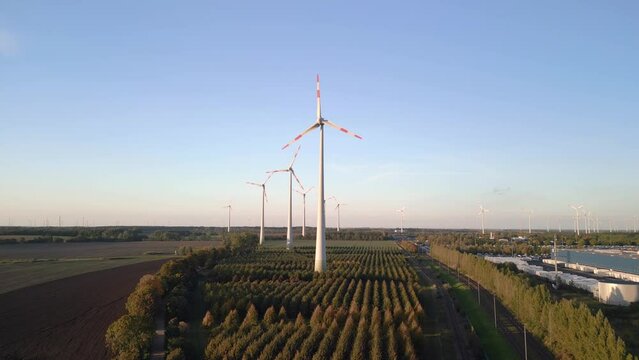Wind farm Renewable energy german wheel Field. Magic aerial view flight drone