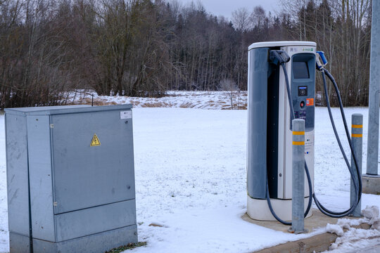 Valka, Latvia - January 22 2023: The electric charging station for electric vehicles. An electric car charging.