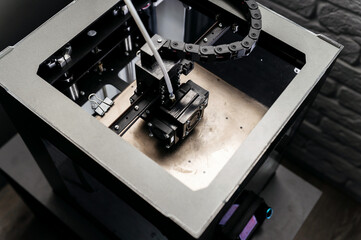 Modern 3D printer homemade in the process. Printing parts on a 3D printer at home. Modern technologies.