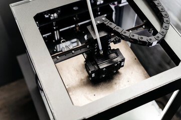 Modern 3D printer homemade in the process. Printing parts on a 3D printer at home. Modern technologies.