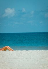 Fototapeta na wymiar woman on the beach legs sea blue relax 
