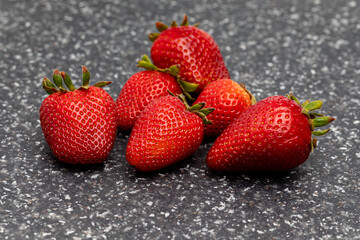 Fresh ripe strawberries on counter. Organic fruit, healthy diet and nutrition concept.