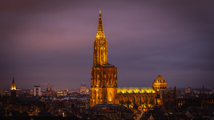 Fototapeta na wymiar Skyline and Cathedral of Strasbourg at night in Strasbourg in France on January 2023