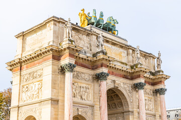 Fototapeta na wymiar Top of the Arc de Triomphe du Carrousel with the replica of the Quadriga of Saint Mark horses in Paris, France