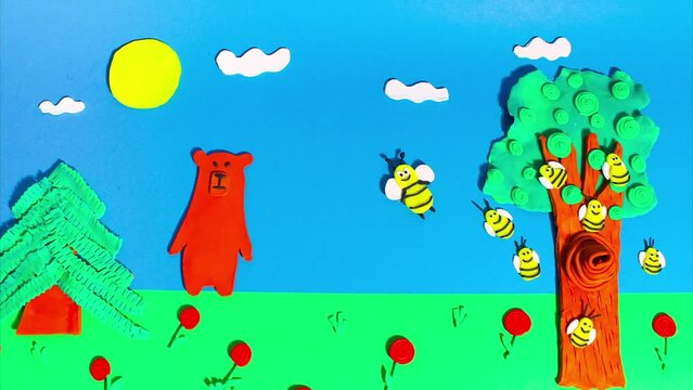 Stop motion animation from plasticine. Bees fly near a beehive on a tree in the forest and a bear approaches them. Claymotion cartoon