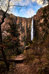 way with waterfall in the background and cloud sky in basaseachi chihuahua 