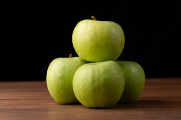 Green apples, Granny Smith, on a dark background.Fresh apples for sale.