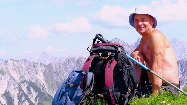 mature man in Seefeld in Tirol, extreme lifestyle of people, mountaineering, via ferrata in mountains, life insurance in extreme sports