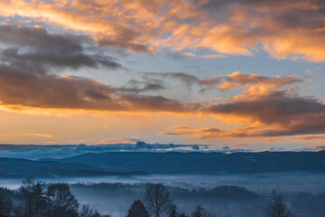 misty sunrise with orange clouds - obrazy, fototapety, plakaty