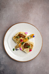 delicious pancakes with filling on a plate
