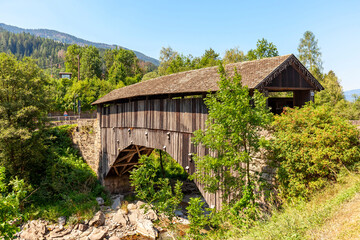 old wooden bridge in ziano di fiemme
