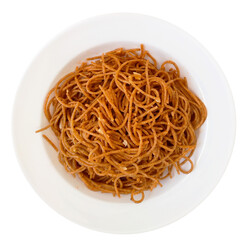 Isolated Plate with wholemeal spaghetti pasta and pieces of garlic
