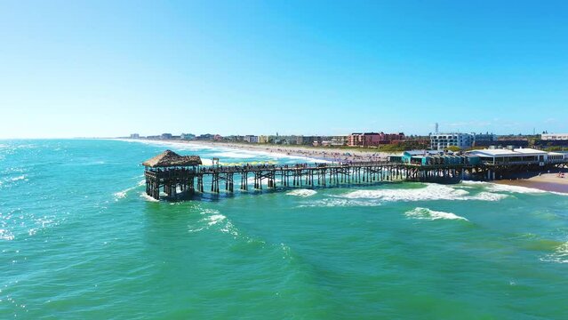 Aerial view of Cocoa beach pier on a sunny winter day in Florida, USA.