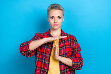 Photo of serious face confident business woman take pause break referee stop rules timeout wear red stylish shirt isolated on blue color background