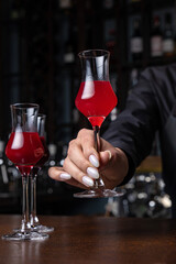Beautiful and delicious alcoholic cocktails prepared at the bar by the bartender
