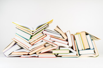 Stack of books lying on white background