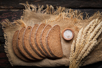 dark flour bread on a wooden table, rustic style