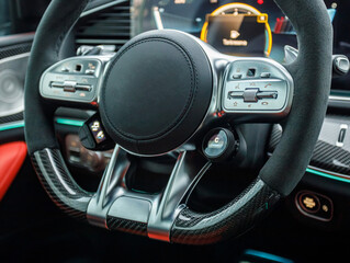 Fototapeta na wymiar stylish sports steering wheel with alcantara in a premium fast car