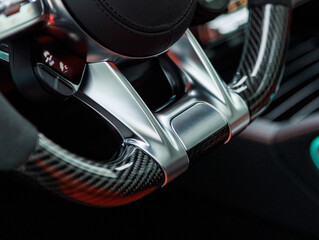 Fototapeta na wymiar exclusive sports steering wheel with alcantara and aluminum in a sports car