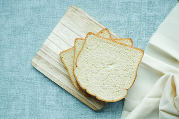 close up of stack of baked bread on table 