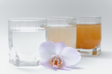 Water filters. Concept of three glasses on a white background. Household filtration system.