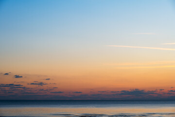 Orange sunset over the sea in winter background