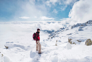 Fototapeta na wymiar Woman Hiking in the High Snowy Winter Mountain .Vitosha Mountain ,Bulgaria 