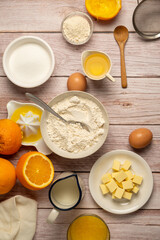 Baking ingredients for cooking, baking orange cake, sugar, flour, milk, copy space