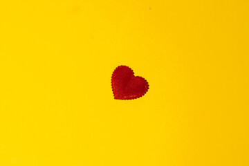 Happy Valentine's day. 14 February. Love. Red heart on a yellow background.