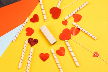Valentine's Day. Frame of gifts, candles, confetti on a colorful background. Valentine's day background.