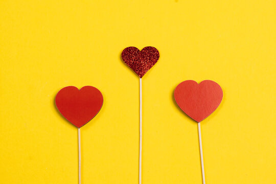 Valentine's Day. Frame of gifts, candles, confetti on a colorful background. Valentine's day background.