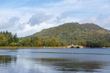 Inveraray, Scotland. Aray Bridge on Loch Fyne in the Scottish Highlands. The spires of Inveraray Castle on left. Dun na Cuaiche watchtower, and Dun Corr Bhile summit. 