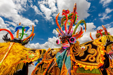 Dancers with typical devil costumes and other representations celebrate the festival of the Virgen de la Candelaria in Puno, Peru.