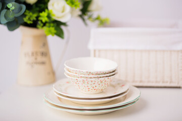 Closeup of porcelain plates and bowls