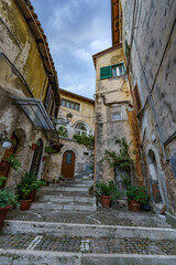 Fototapeta premium An old atmospheric city with narrow and cramped quiet streets and stairs