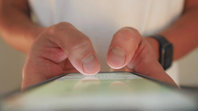 Woman chatting online on smartphone macro close up, typing text message, touching touchscreen keyboard, using messenger application. Female holding mobile phone, close up, swiping social media. 