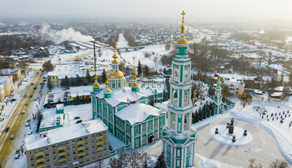 Winter aerial view of Tambov cityscape and Orthodox Transfiguration Cathedral covered with snow, Russia