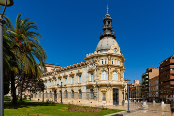 Fototapeta na wymiar View of magnificent Art Nouveau building of City Hall in Spanish city of Cartagena on summer day