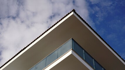 facade cornice with balconies against blue sky