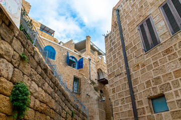 Fototapeta na wymiar Colorful blue shutters on a historic building in the historic Old Jaffa district along the Mediterranean coast near Tel Aviv, Israel.