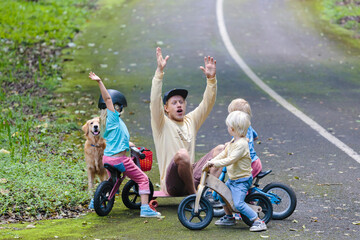 Father with three children in park
