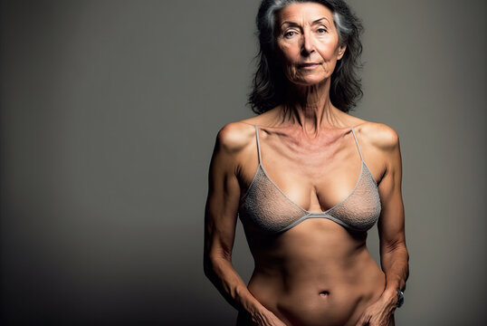 Attractive 65-year-old senior woman posing empowered and happy, in underwear, with age-imperfect body. Ai generated