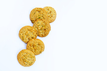 pistachio and almond cookies on white background.
