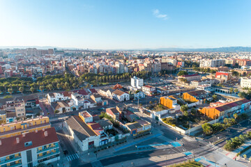 Aerial view of houses by the promenade and beach of Valencia