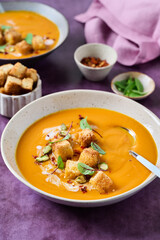 Bowl of pumpkin or carrot soup