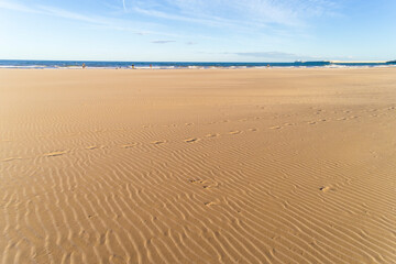footprints on the sand on the beach of Valencia
