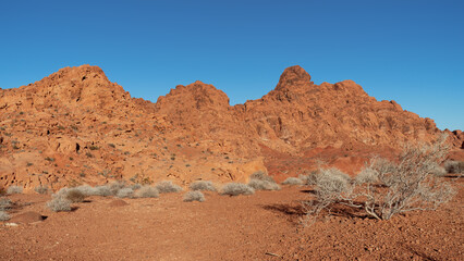 Eroded red sandstone formations shown at Valley of Fire in Nevada, United States. The park has a National Natural Landmark designation and is located within the Mojave Desert.