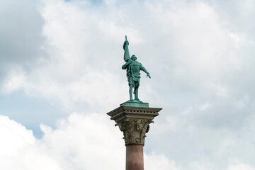 Fototapeta premium statue of Engelbrekt The Freedom Fighter sited on top of a pillar in the Stadshuset Garden in Stockholm